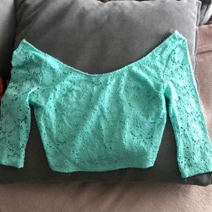 Crop Top w/ shoulders showing. Back is see through